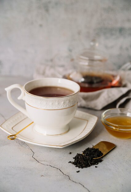 White cup of tea on marble background