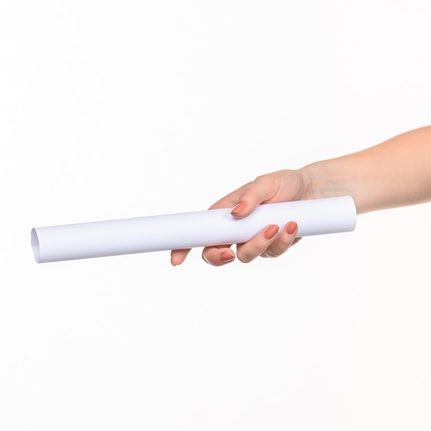 The white cylinder of the props in the female hands on white background with  right shadow