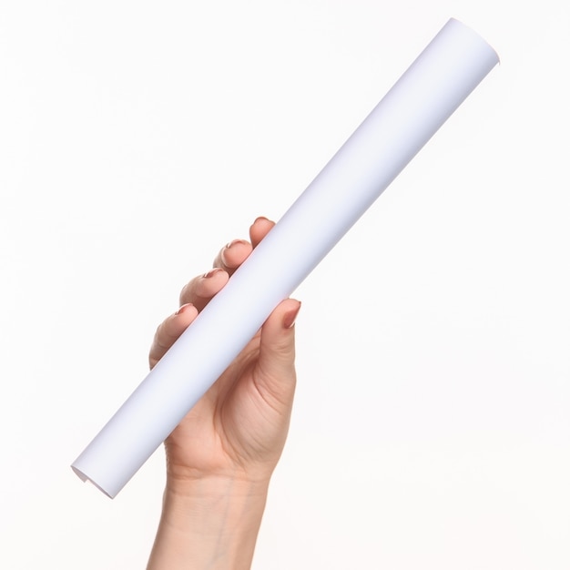 The white cylinder of the props in the female hands on white background with  right shadow