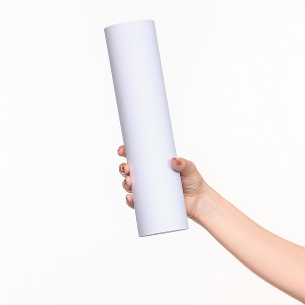 The white cylinder of the props in the female hands on white with  right shadow