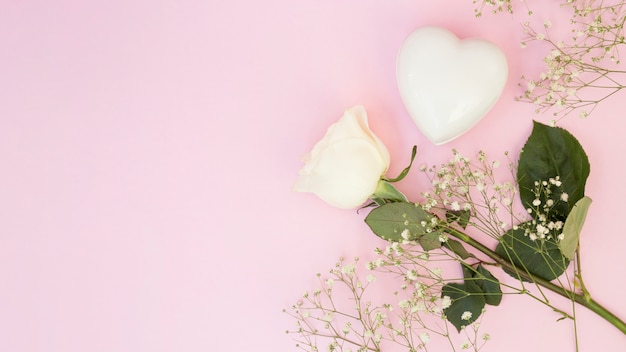 White decorative heart near plants and flower 