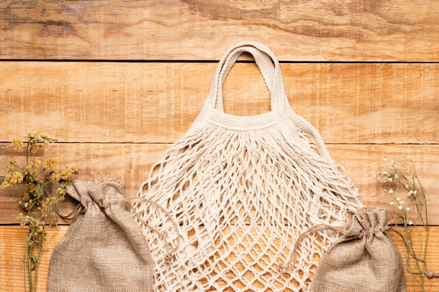 Free photo white eco friendly bag on wooden background