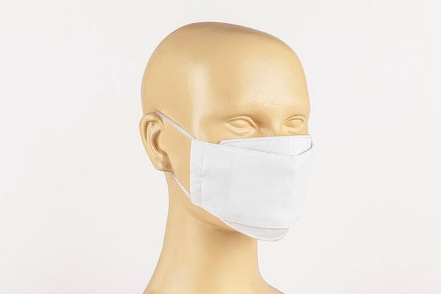 White fabric face mask on a mannequin