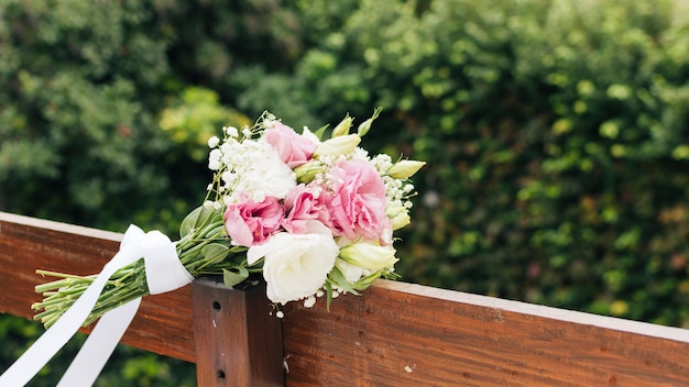 White flower bouquet on wooden plank