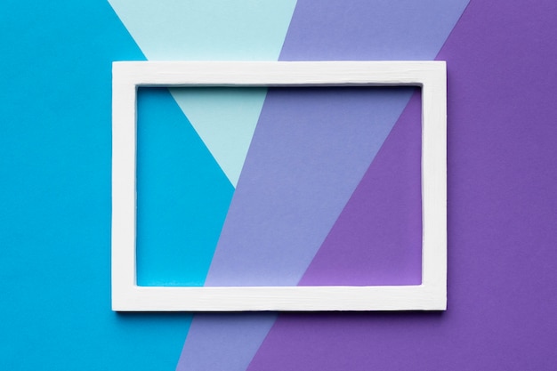 Free Photo white frame on colorful background top view