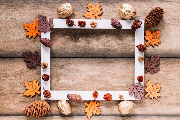 Free photo white frame with autumn elements