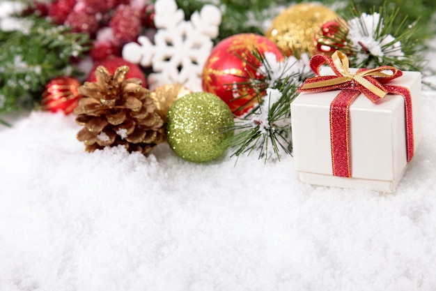 White gift with christmas ornaments