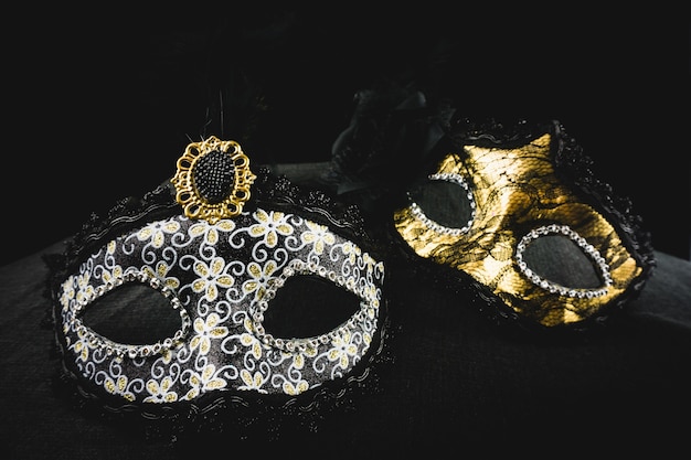 White and golden mask on a dark background