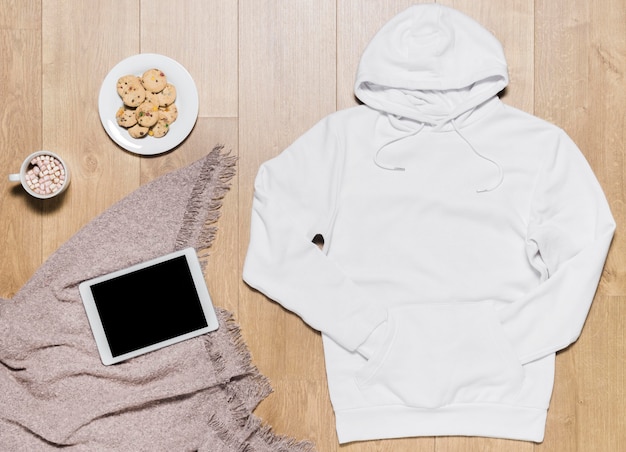 Free Photo white hoodie with cookies plate