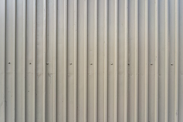 White iron tin fence lined background. Metal texture