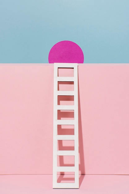 White ladder with pink circle