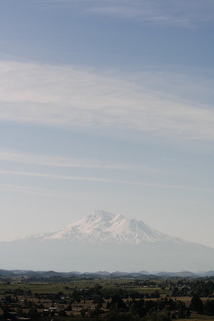 White mountain near town under a clear sky