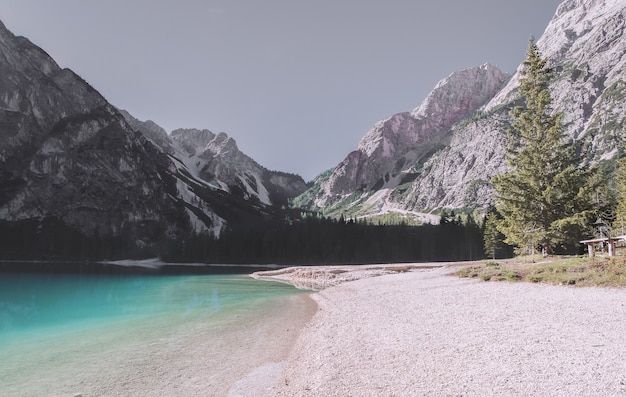 Free Photo white mountain ridge near body of water