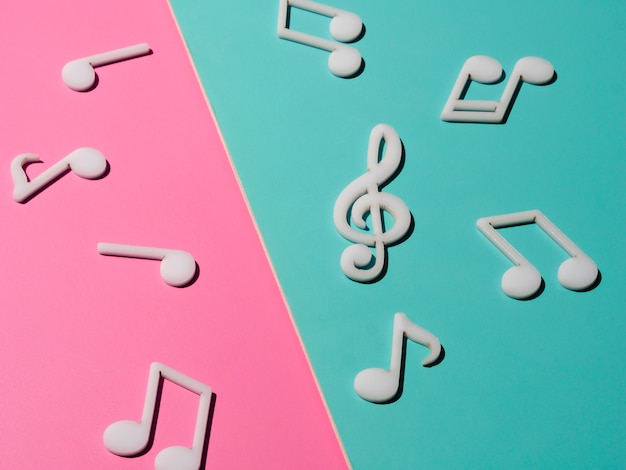 Free photo white musical notes on bright colorful background