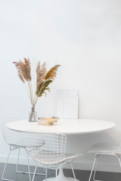 Free Photo white photo frames on table interior design