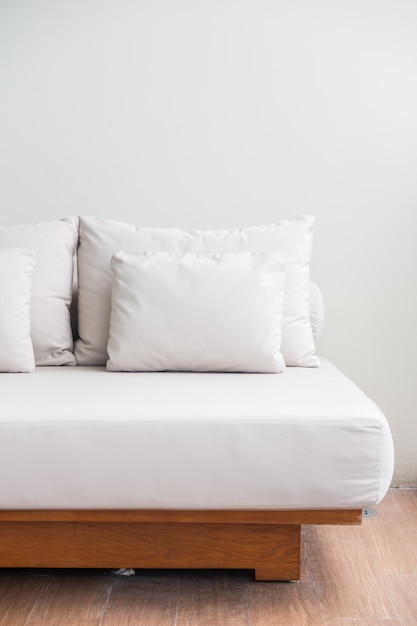 Free photo white pillows stacked