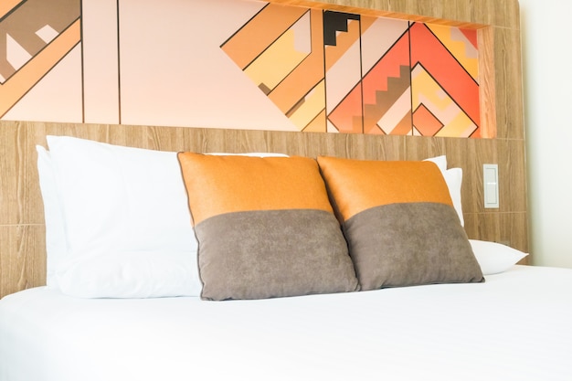 White pillows with orange cushions