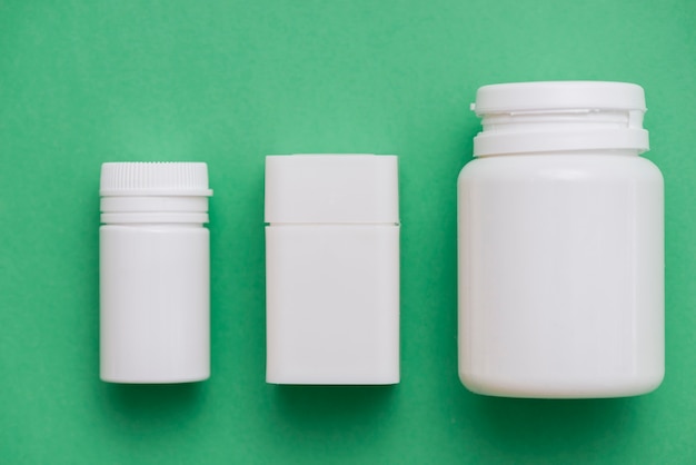 Free Photo white pills containers arrangement