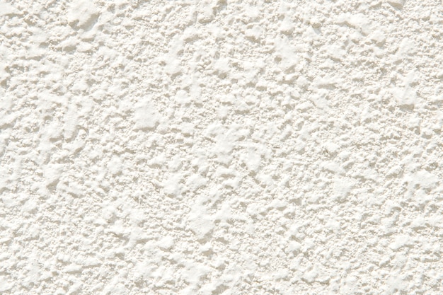 White plastered wall with a rough surface