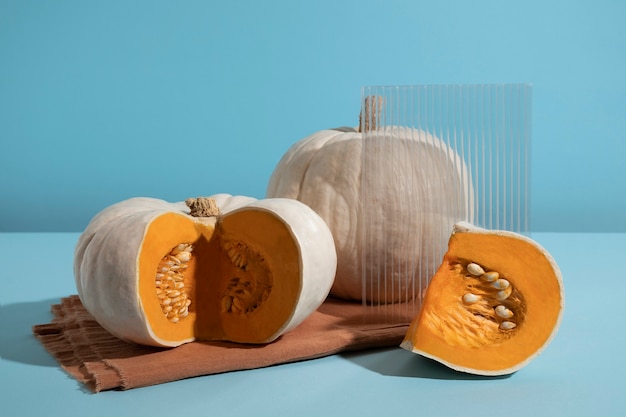 White pumpkins on blue background