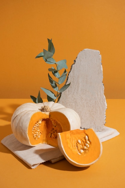 White pumpkins with orange background