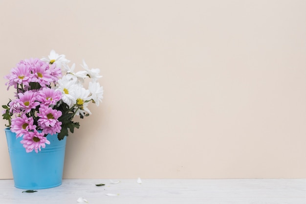 White and purple flowers in basket