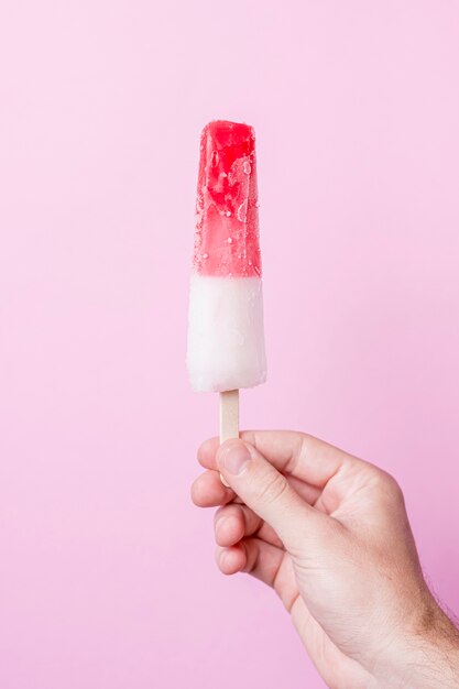 White and red cold ice cream on stick