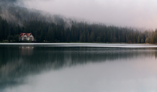 White and Red House Under Fog