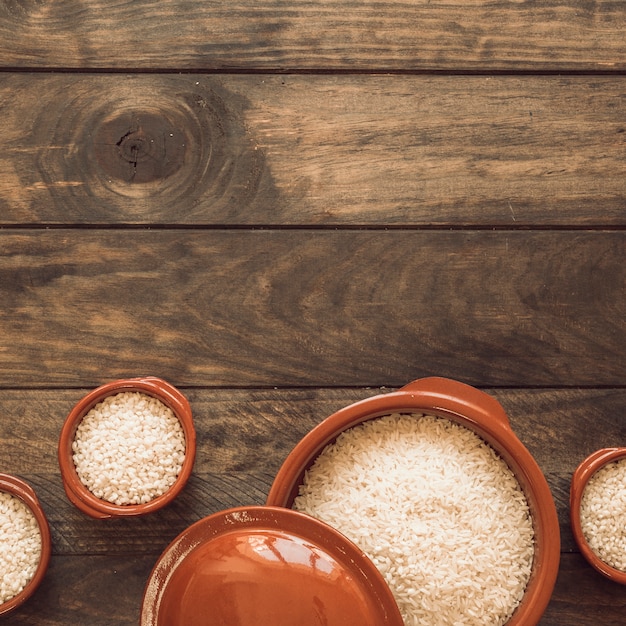 White rice in bowl on wooden table