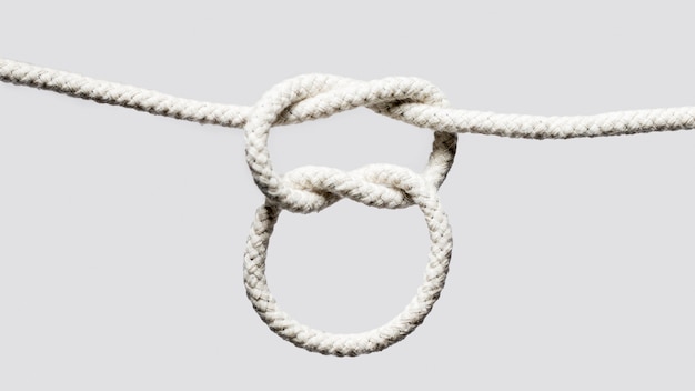 Free photo white ropes with square knots