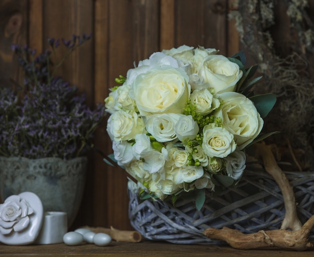 White rose bouquet on a rustic furniture