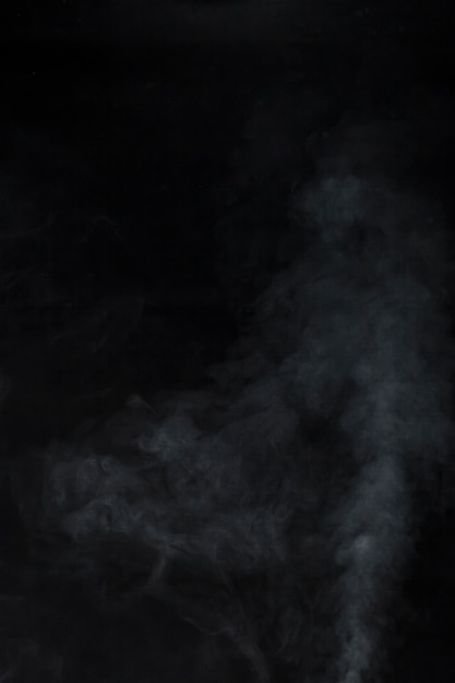 White smoke on black background