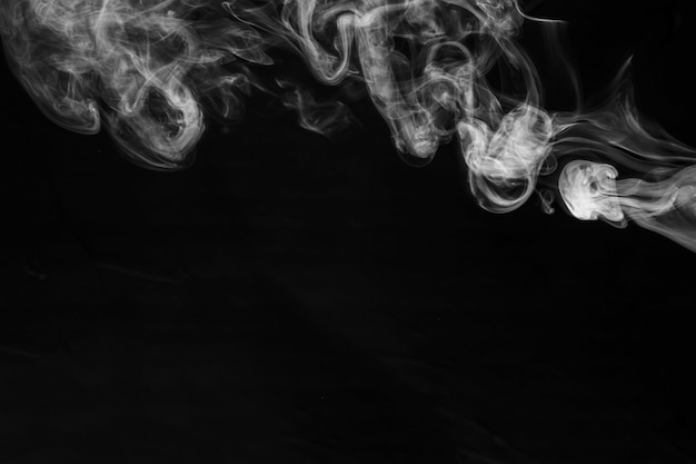 White smoke on the black background