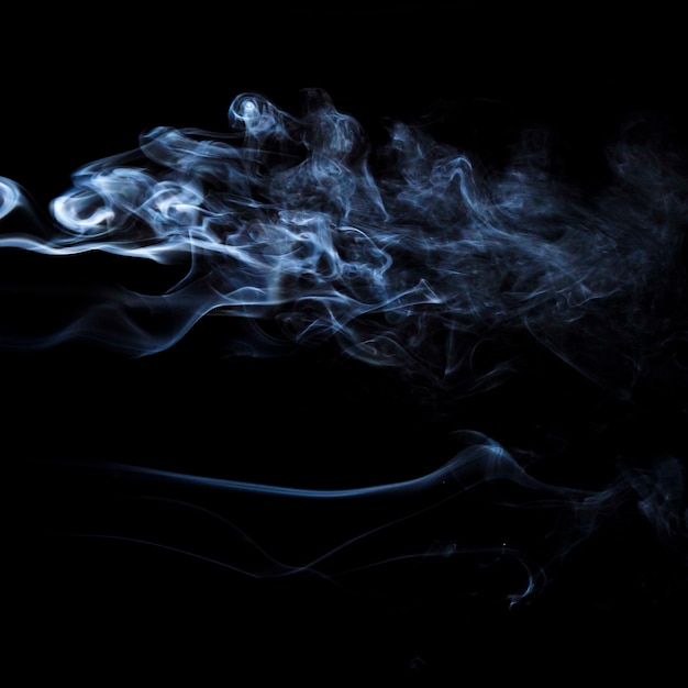 White smoke movement on black background