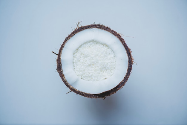 Free Photo white surface with half coconut