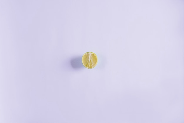 Free photo white surface with half lemon