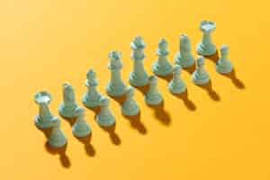 Free photo white team chess on yellow background