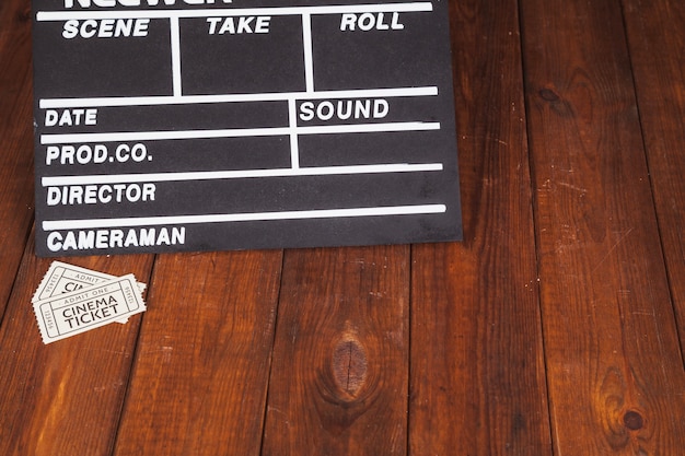 Free Photo white tickets and clapperboard