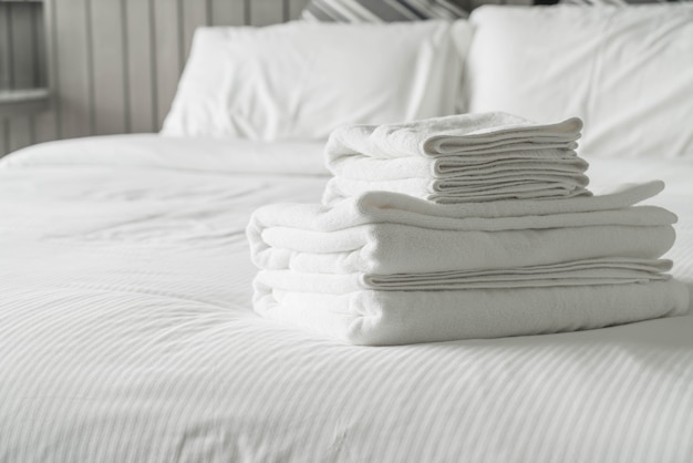 White towel on bed decoration in bedroom interior