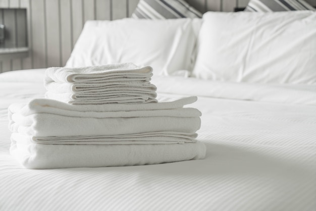 White towel on bed decoration in bedroom interior