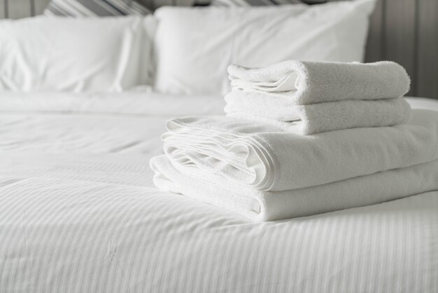 White towel on bed decoration in bedroom interior