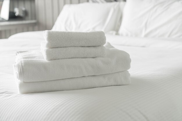 White towel on bed decoration in bedroom interior