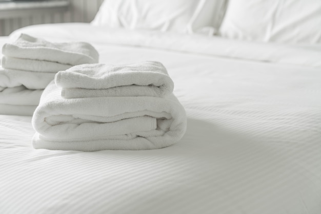 White towel on bed decoration in bedroom interior