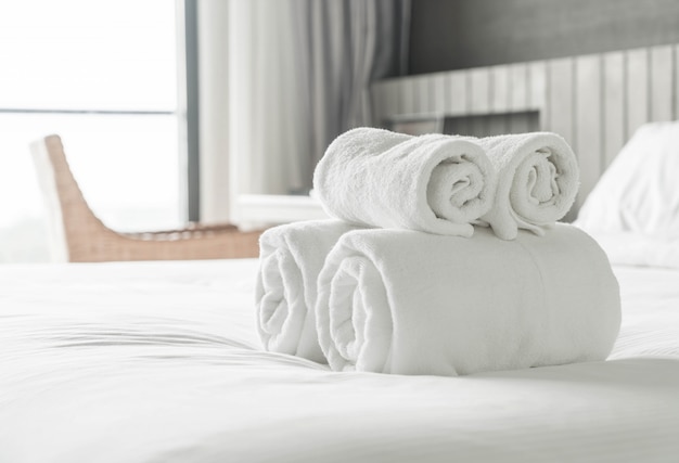 White towel on bed decoration in bedroom interior