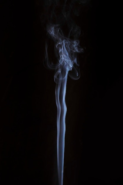 Free photo white transparent smoke trail on dark background