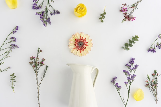 White vase with decorative flowers