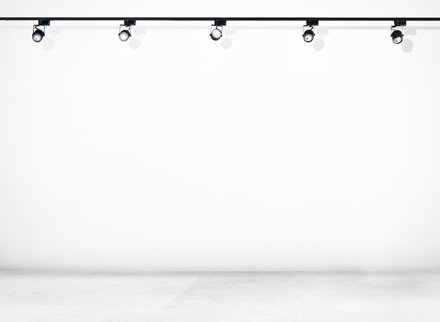 Free Photo white wall and concrete floor with spotlights