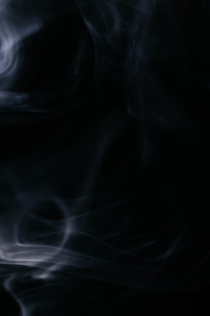 Free photo white wavy smoke on black background