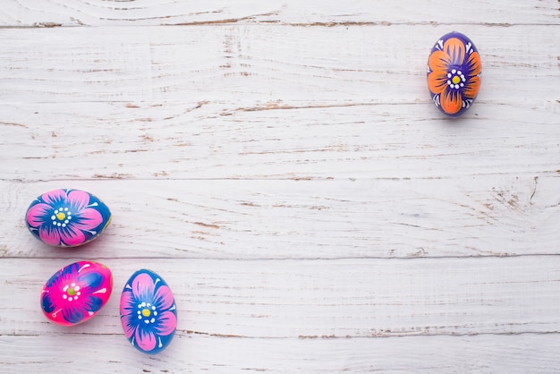 White wooden surface with beautiful easter eggs