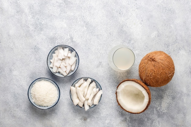 Whole coconut and various pieces of coconut